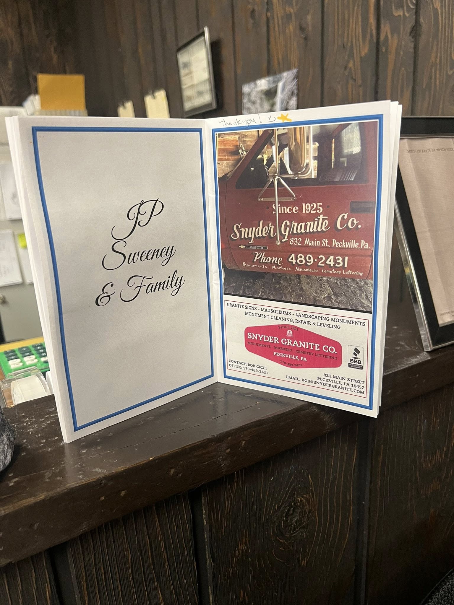 Snyder Granite printed business card listing the shop address, phone number, services, and BBB accreditation