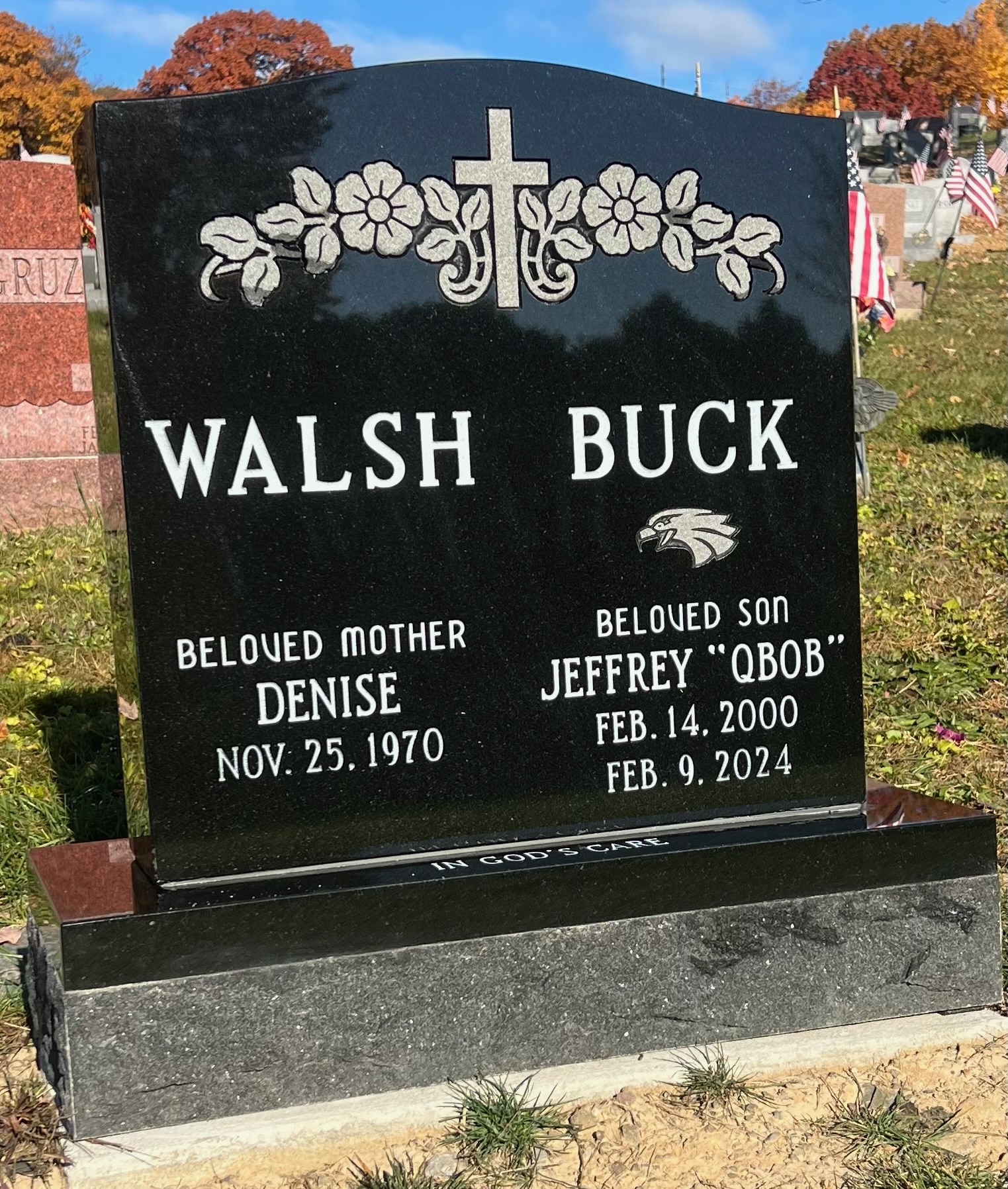 Walsh and Buck black granite monuments with gold floral designs
